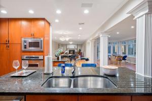 a kitchen with a sink and a counter top at Huge Retreat w Alaska King, Pool & Jacuzzi Tub Indoor in Goshen
