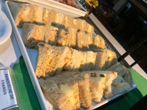 a bunch of sandwiches on a tray in a display case at Valen Porto Hotel São Luís in São Luís