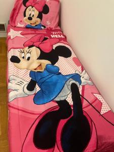 a bed with a mickey mouse and a mickey mouse at HOTEL&Restaurant DALLAS in Myślenice +22 photos
