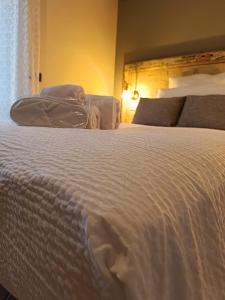 Ένα ή περισσότερα κρεβάτια σε δωμάτιο στο Lugana Relais