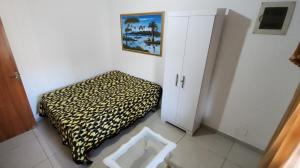 En eller flere senge i et værelse på Quartos privativo perto da praia de Itaparica