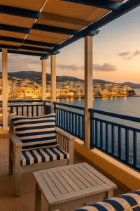 a balcony with two chairs and a view of the water at Sea view in Karpathos +27 photos