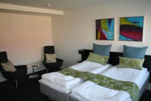 Postel nebo postele na pokoji v ubytování Seaside Hotel Thyborøn