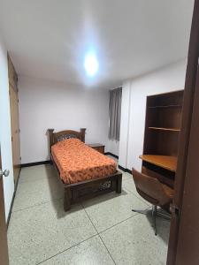 En eller flere senge i et værelse på Apartamento Av Las Americas 3 habitaciones