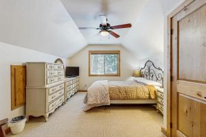 a bedroom with a bed and a ceiling fan at Deer Trail in McCall
