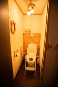 a bathroom with a toilet in a small room at Otaro Village - Vacation STAY 93983v in Otaru