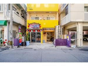 a yellow building on a street in a city at Yellow Submarine - Vacation STAY 67585v in Naha