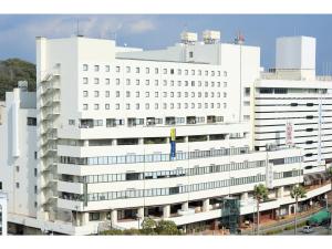 a large white building with many windows at Smile Hotel Tokushima - Vacation STAY 61131v in Tokushima