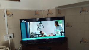 a flat screen tv sitting on top of a table at PROF OLIVETO ANTICo in San Marco in Lamis