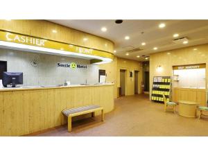 a lobby of a smile food store with a counter at Smile Hotel Nagoya Shinkansenguchi - Vacation STAY 77724v in Nagoya