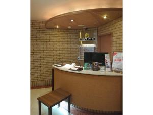 a counter in a restaurant with a bench in front at Smile Hotel Kobe Motomachi - Vacation STAY 85861v in Kobe +27 photos