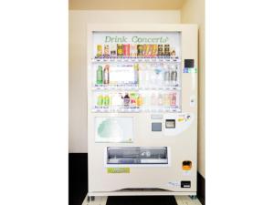 an open refrigerator with drinks inside of it at Smile Hotel Kobe Motomachi - Vacation STAY 85861v in Kobe