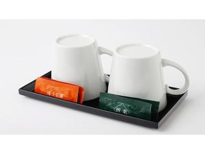 two white mugs on a black tray at Smile Hotel Kobe Motomachi - Vacation STAY 85859v in Kobe