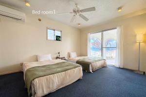 En eller flere senge i et værelse på Ishikawa Kona Garden - Vacation STAY 90793v + 35 billeder