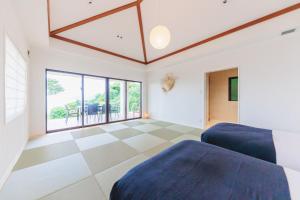 Ένα ή περισσότερα κρεβάτια σε δωμάτιο στο Breathing Inn Ishigaki Tida - Vacation STAY 91574v
