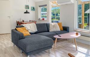 a living room with a couch and a table at Gorgeous Home In Odder With Wifi in Odder