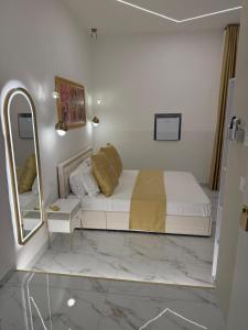 Postel nebo postele na pokoji v ubytování Belle Ame Suites