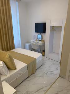 TV a/nebo společenská místnost v ubytování Belle Ame Suites + 37 fotografií