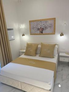 Postel nebo postele na pokoji v ubytování Belle Ame Suites