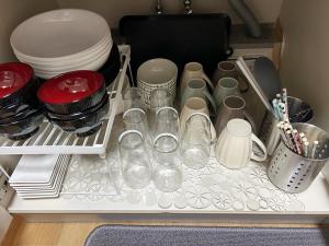 a drawer full of dishes and plates in a refrigerator at Funabashi - House - Vacation STAY 19790 in Funabashi +11 photos