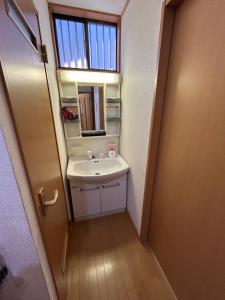 a bathroom with a sink and a mirror at Funabashi - House - Vacation STAY 19790 in Funabashi
