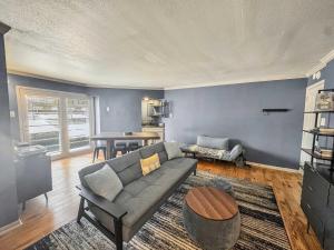 a living room with a couch and a table at The House of the Austin Blues in Austin