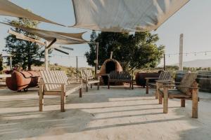 a group of chairs sitting under a tent at DaNik Valle in Francisco Zarco