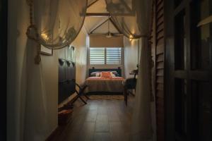 a bedroom with a bed and a window at CozyBeach large 1BdrApt 50 steps from Atlantic Ocean private street between Ocean Park & Isla Verde 5 mins from Airport in San Juan