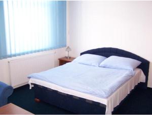 Postel nebo postele na pokoji v ubytování Hotel U Jelena