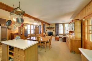 a kitchen and dining room with a table and chairs at Private Sandy Beach Lake Superior Group Retreat in Marquette