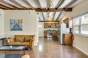 a living room with a couch and a kitchen at 1 Block to Beach Sea Isle City Retreat with Patio! in Sea Isle City