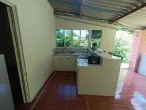 a kitchen with a sink and a counter top at Casa Blanca el Zonte in El Zonte +14 photos