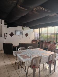 a dining room with a table and chairs at Posada Colonial El Buen Pastor in Antigua Guatemala