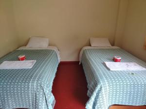 Postel nebo postele na pokoji v ubytování Lucmabamba Cottage