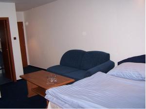 Postel nebo postele na pokoji v ubytování Hotel U Jelena