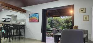 a kitchen and dining room with a table and a window at Casa Catalana in San Vito +15 photos