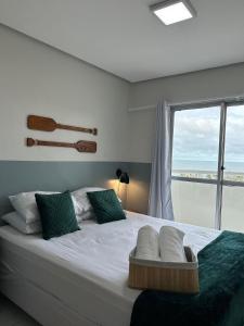 Katil atau katil-katil dalam bilik di (204) Inesquecível Vista Mar na praia da Litorânea
