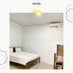 Postel nebo postele na pokoji v ubytování Charlitoz Homestay