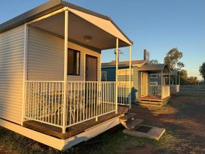 a house with a porch on the side of it at The Eulo Queen Hotel 
