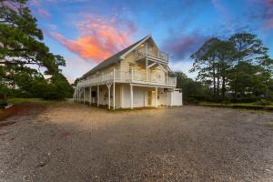 a large white house with a balcony on a lot at Ft Morgan Bama Belle-Beach Access in Gulf Shores