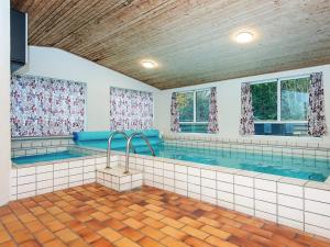 a large indoor swimming pool in a house at 10 person holiday home in Glesborg-By Traum in Glesborg
