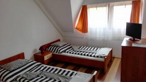 Postel nebo postele na pokoji v ubytování Juniperus Park Hotel Kecskemét + 8 fotografií
