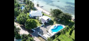 an aerial view of a house with a swimming pool at Bermuda Beach Aquatica in Daanbantayan