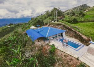 an overhead view of a house with a blue roof at Rancho Buenavista in Vergara