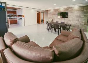 a living room with a couch and a table at Rancho Buenavista in Vergara