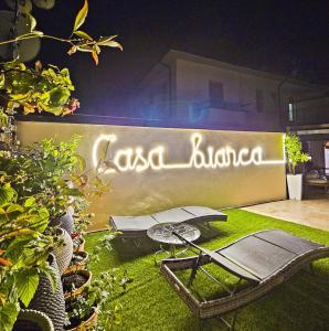 a sign that says casa blanca on a wall at Casa Bianca Luino Terrace View in Luino