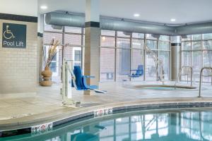a swimming pool in a building with a pool lift at Holiday Inn Boise Airport by IHG in Boise