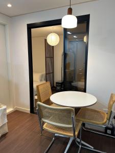 a table and chairs in a room with a bedroom at Seoul Station Hanok concept in Seoul