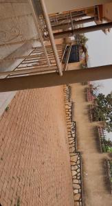 an overhead view of a brick walkway under a bridge at Moods Holiday Homes in Kampala +8 photos