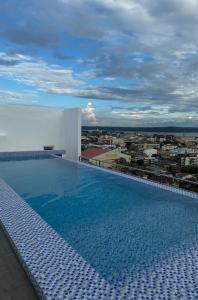 a large swimming pool on the roof of a building at Iloilo Condo Perfect for Couple in Iloilo City